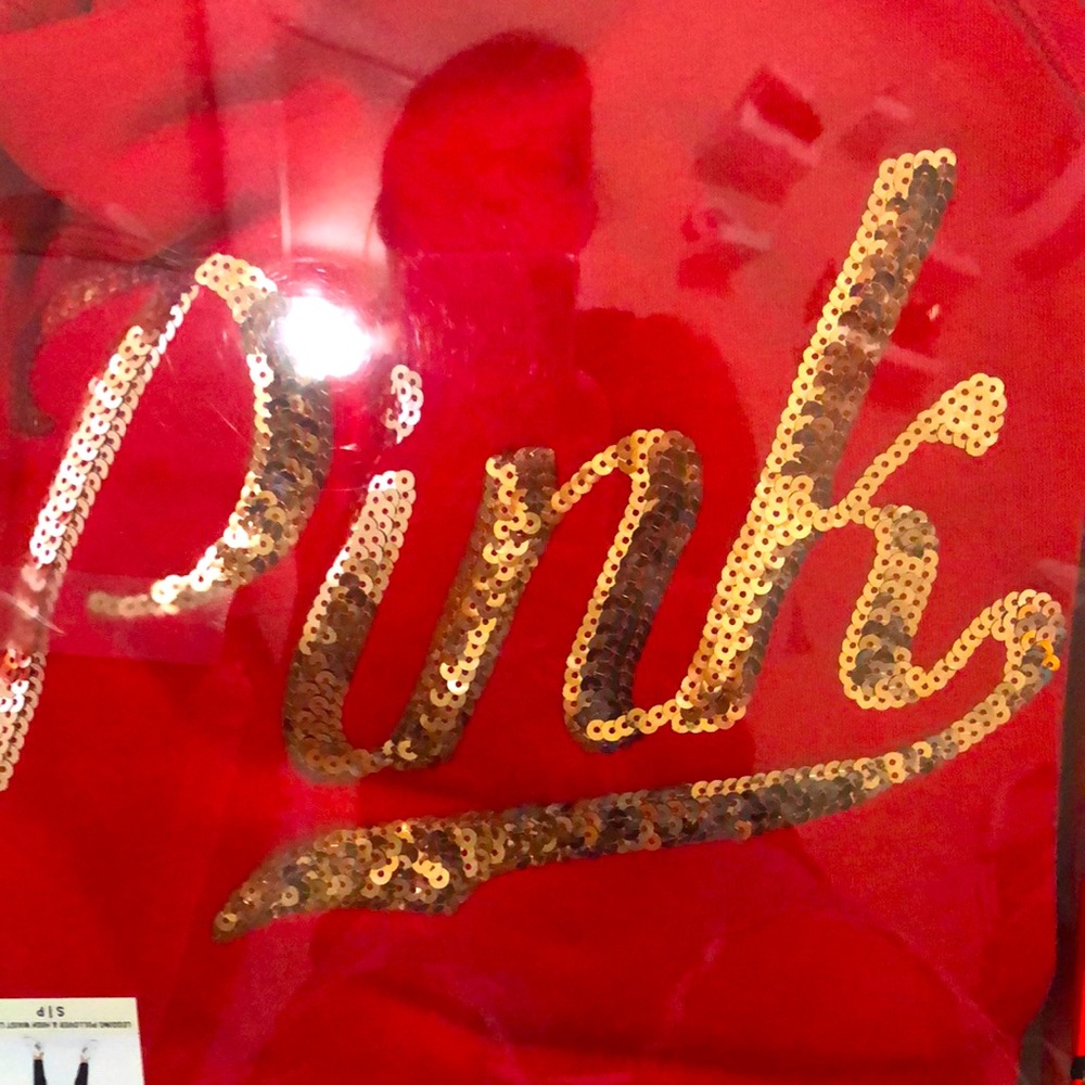 Red sweatshirt n a pair of leggings never worn